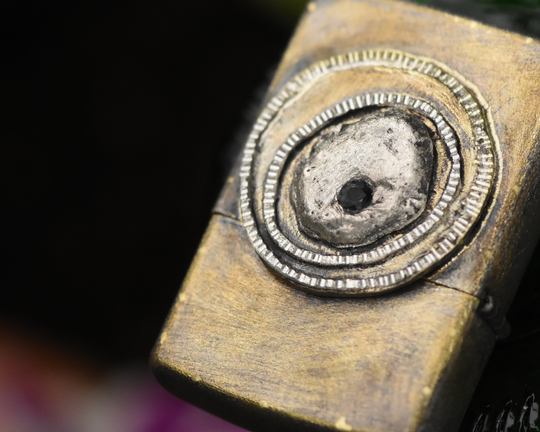 One of One—An Eye & A Flame Lighter