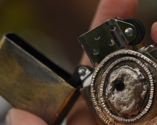 One of One—An Eye & A Flame Lighter