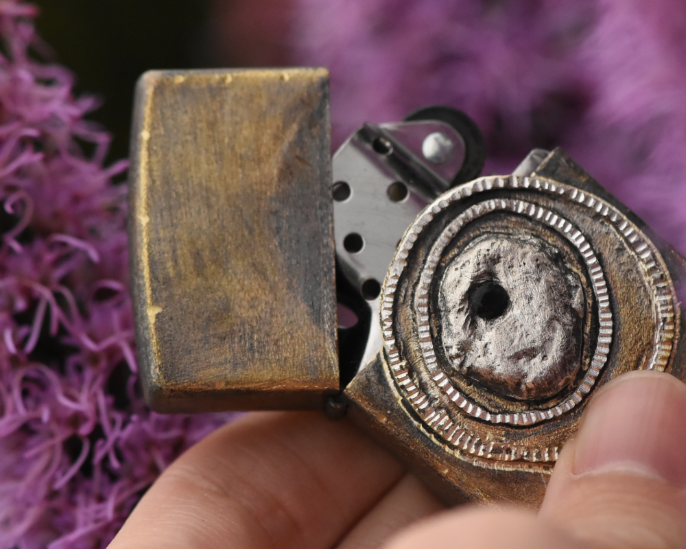 One of One—An Eye & A Flame Lighter