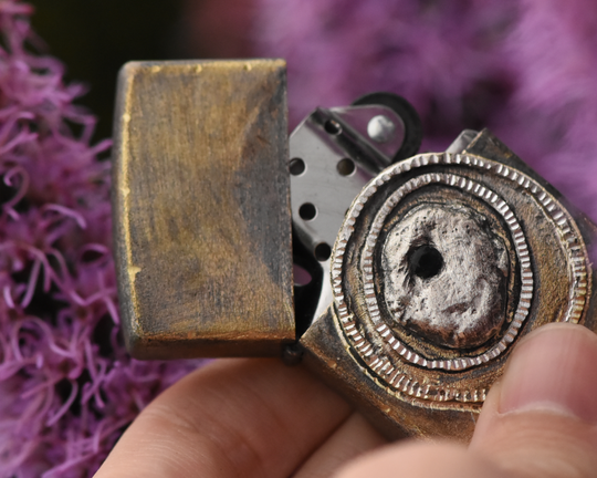 One of One—An Eye & A Flame Lighter