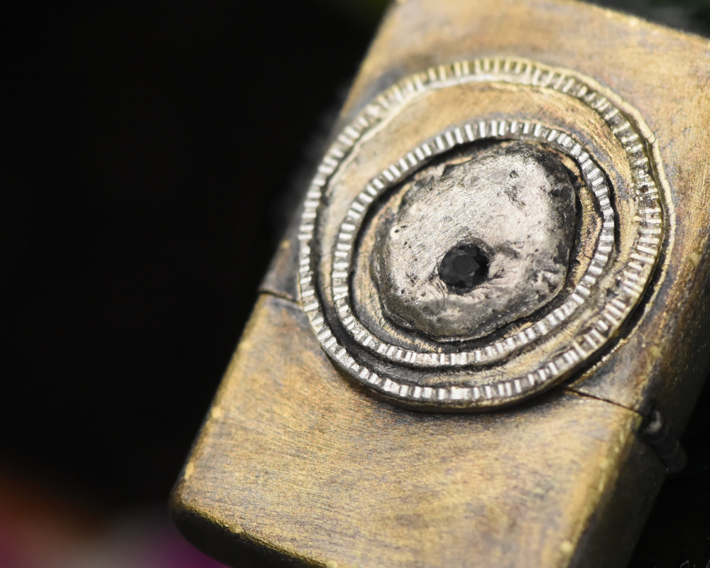 One of One—An Eye & A Flame Lighter