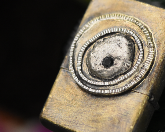 One of One—An Eye & A Flame Lighter